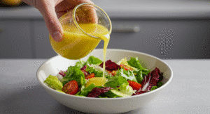 Pouring dressing on dense bean salad